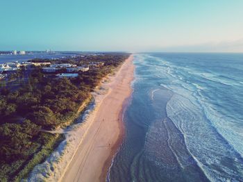 Panoramic view of beach against clear sky