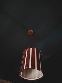 Low angle view of illuminated pendant light hanging from ceiling