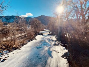 Scenic view of frozen lake against sky during winter