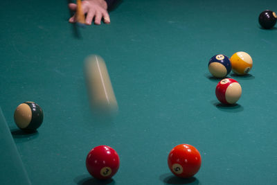 Man playing with ball on table