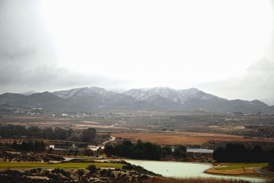 Scenic view of agricultural landscape against sky