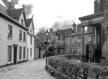 Street amidst buildings against sky