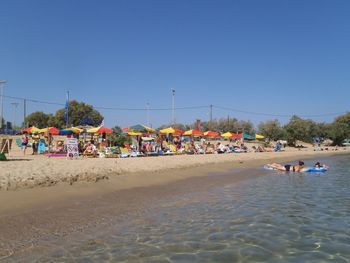 People enjoying at seaside