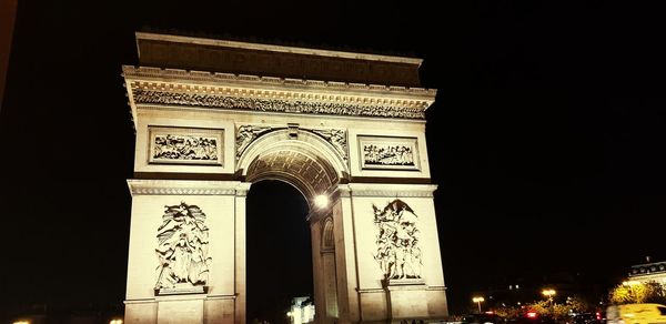 Low angle view of historical building at night