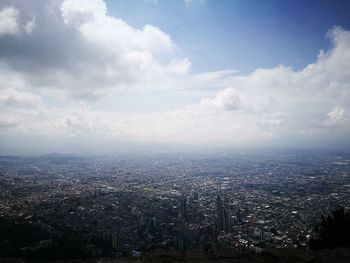 Aerial view of cityscape against sky