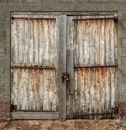 Closed door of old  farm building