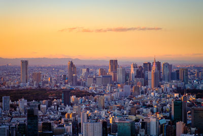 Cityscape against sky during sunset