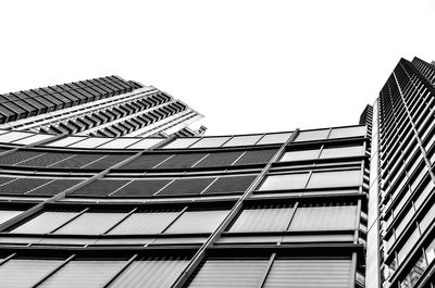 Low angle view of modern buildings against clear sky