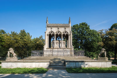 Low angle view of statue against clear blue sky