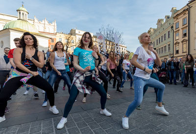 Group of people at music concert in city