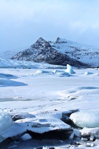 Scenic view of snowcapped mountains against sky