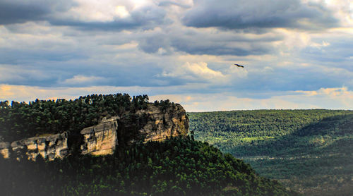 Tranquil view of cliff against sky