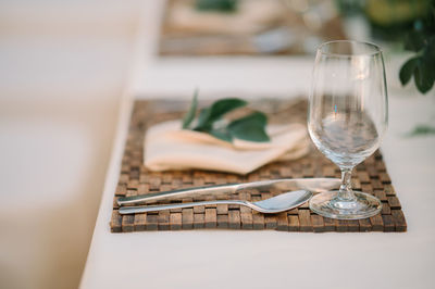 Close-up of wine glasses on table