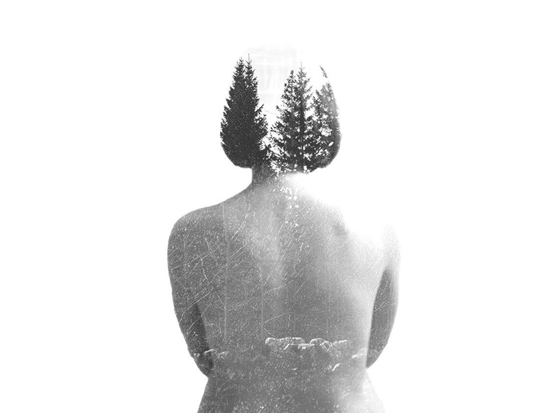 REAR VIEW OF WOMAN AGAINST WHITE GRAY BACKGROUND