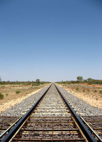 View of railroad tracks against clear sky