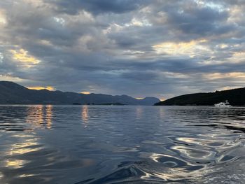 Scenic view of lake against sky during sunset