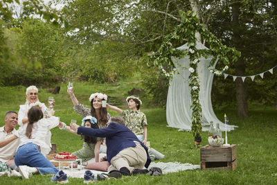 Family having picnic during midsummer