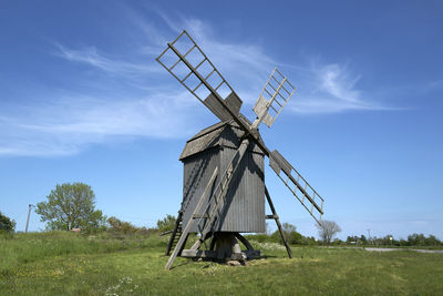 Built structure on field against sky