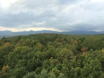 Scenic view of mountains against cloudy sky