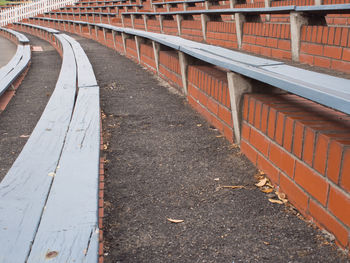 Wooden bench seating at a sports ground