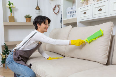 Young woman using digital tablet at home