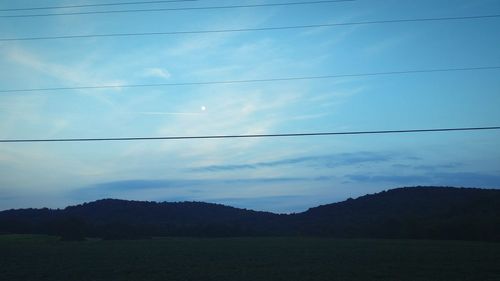 View of birds flying over landscape