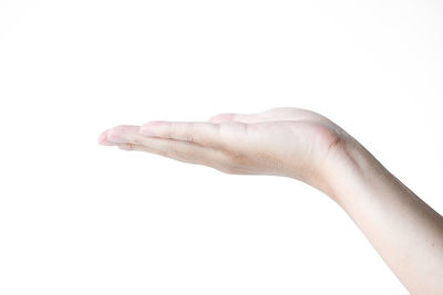 Close-up of hand against white background