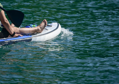 Paddle board along the water