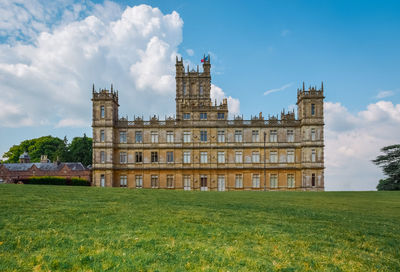 View of lawn with buildings in background