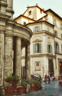 People in front of historical building