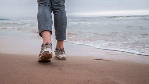 Low section of man on beach