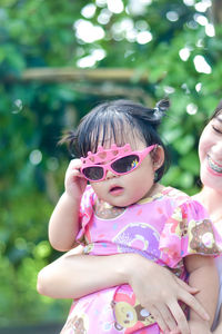 Portrait of young woman wearing sunglasses