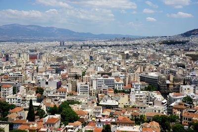 Cityscape with mountain range in background
