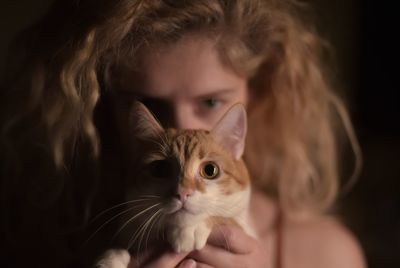 Close-up portrait of cat at home