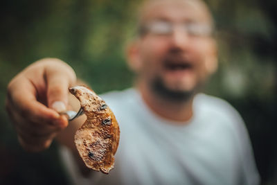 Close-up of man holding ice cream