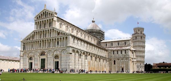 People at campo dei miracoli against sky