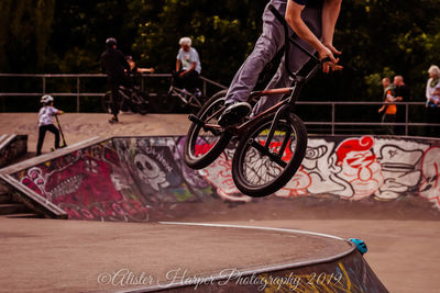 People in front of skateboard