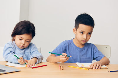 Boy drawing at home