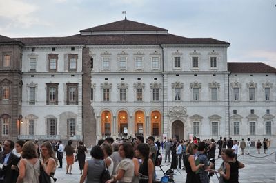 People in front of historical building