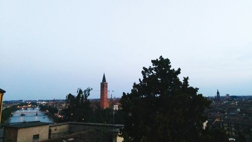 Panoramic view of buildings in city against clear sky