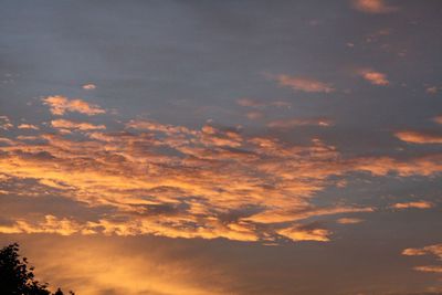 Low angle view of cloudy sky at sunset