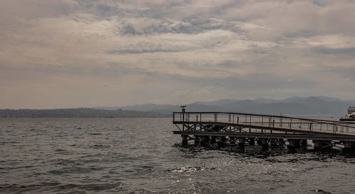 Bridge over sea against sky