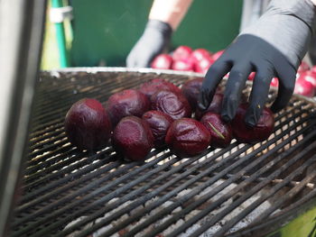Close-up of redbeets on hand