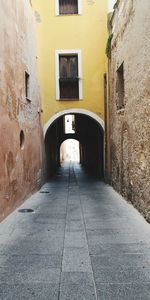 Narrow alley along buildings