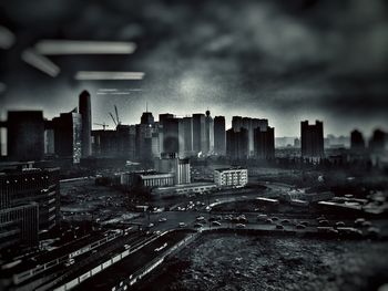 Cityscape against cloudy sky