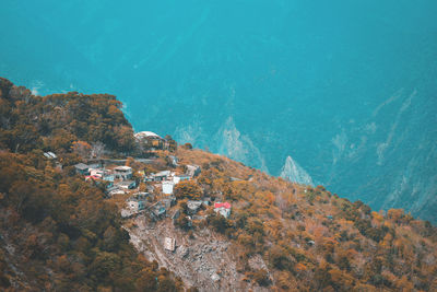 High angle view of buildings by sea