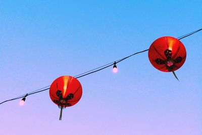 Low angle view of chinese lantern against clear sky