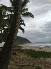 Scenic view of sea against cloudy sky