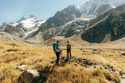 Rear view of man walking on mountain