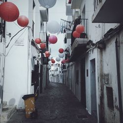 Alley amidst buildings in city